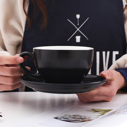Coffeezone latte art saucer in matte black, supports stable cup placement for barista routines.