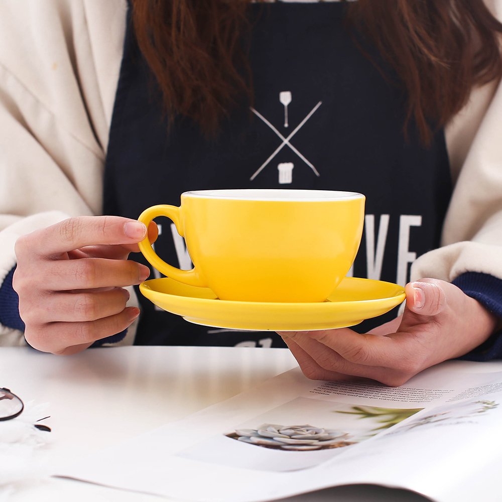 Coffeezone matte-yellow cup and saucer with round-bottom design for easier latte art.