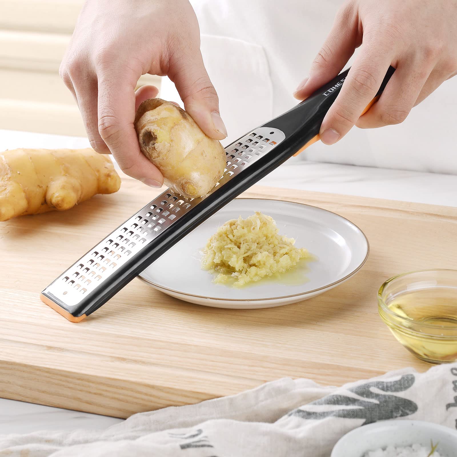 Cohesion etched zester-grater creates vibrant fruit ribbons for garnishes
