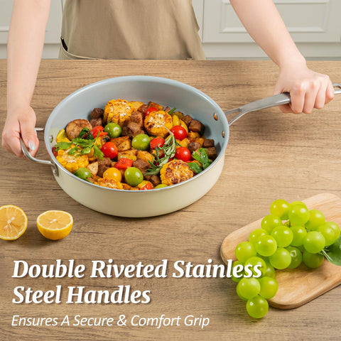Coicur pan with stainless steel helper handle offers secure grip.