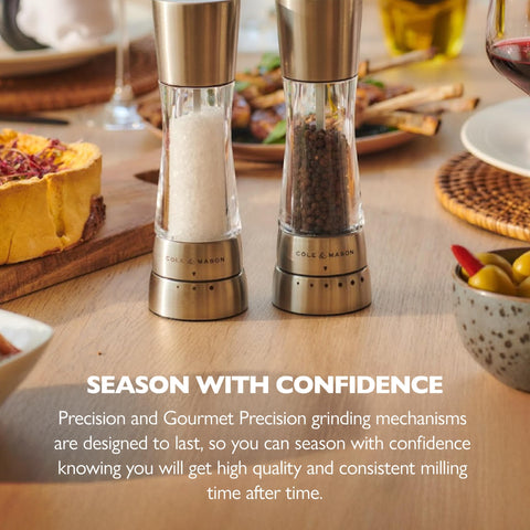 Cole & Mason Derwent pepper mill in use over dish for fresh pepper.