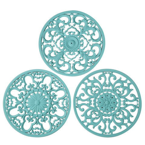 Colinda trivet turquoise design A with decorative heat-safe pad for hot dishes.