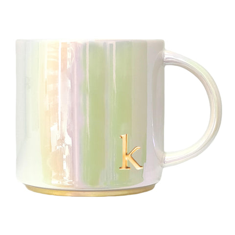 COLLECTIVE HOME ceramic mug with iridescent finish enhances morning coffee ritual.