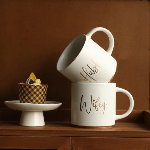 COLLECTIVE HOME morning-coffee-scene mug in hands, enjoying warmth.