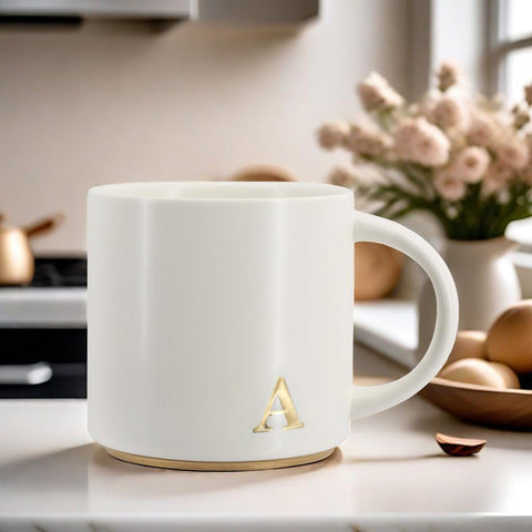 COLLECTIVE HOME dishwasher-safe mug with gold lettering for easy care.