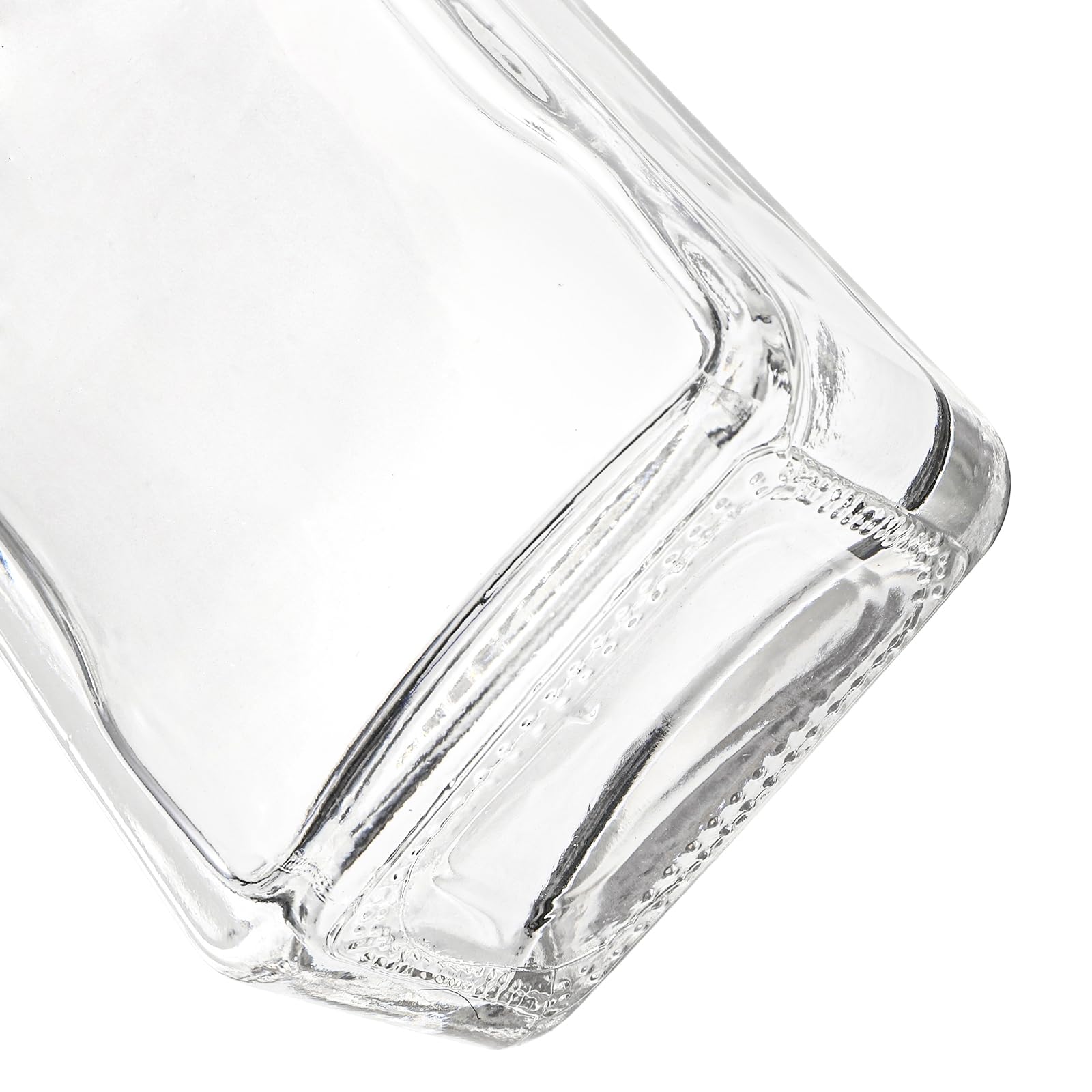 Coloch heavy-base clear glass bottle highlighting liquid color and clarity