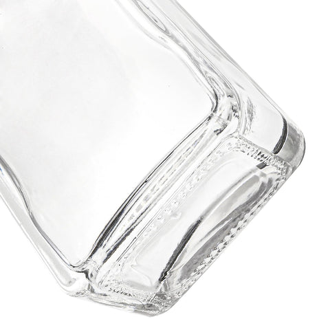 Coloch heavy-base clear glass bottle highlighting liquid color and clarity