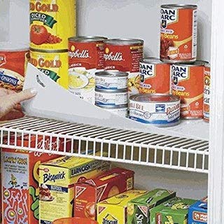 Conimar shelf liner trimmed to fit 16-inch depth for a clean shelf.
