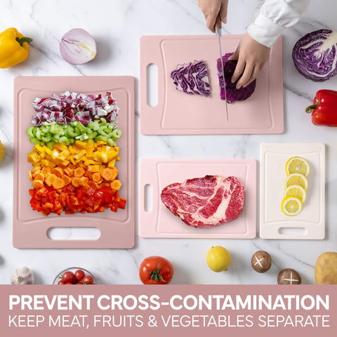 COOK WITH COLOR pink cutting board with easy grip handle for carrying and drying.