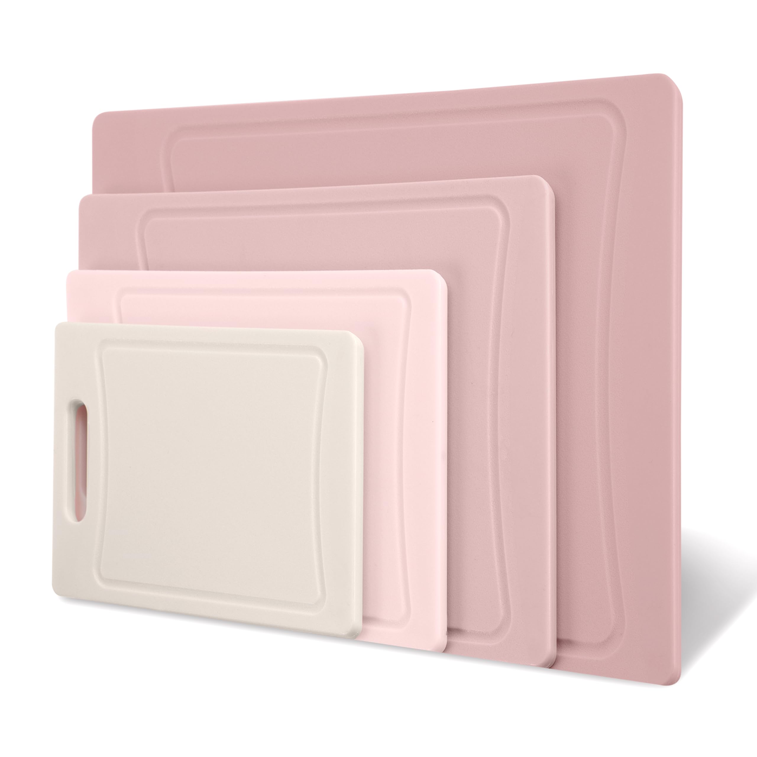 COOK WITH COLOR pink cutting boards hung for easy storage after use.
