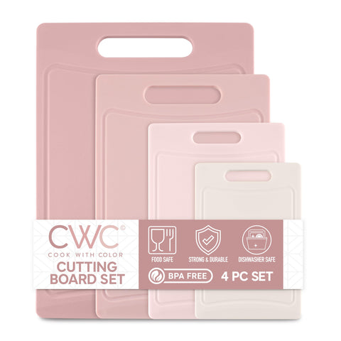 COOK WITH COLOR pink small cutting board with easy grip handle for precise chopping.
