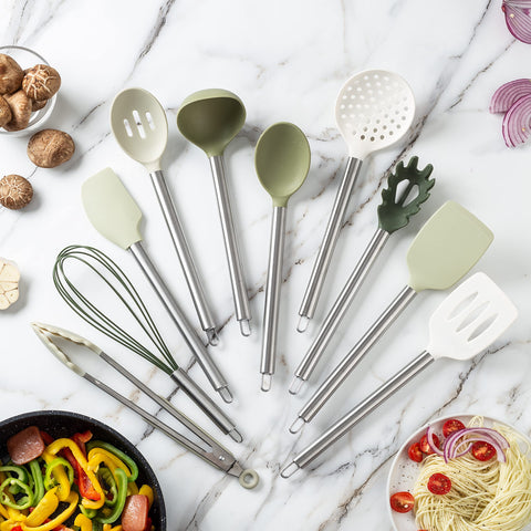 Cook With Color green silicone slotted spoon demonstrating heat resilience up to 500°F.