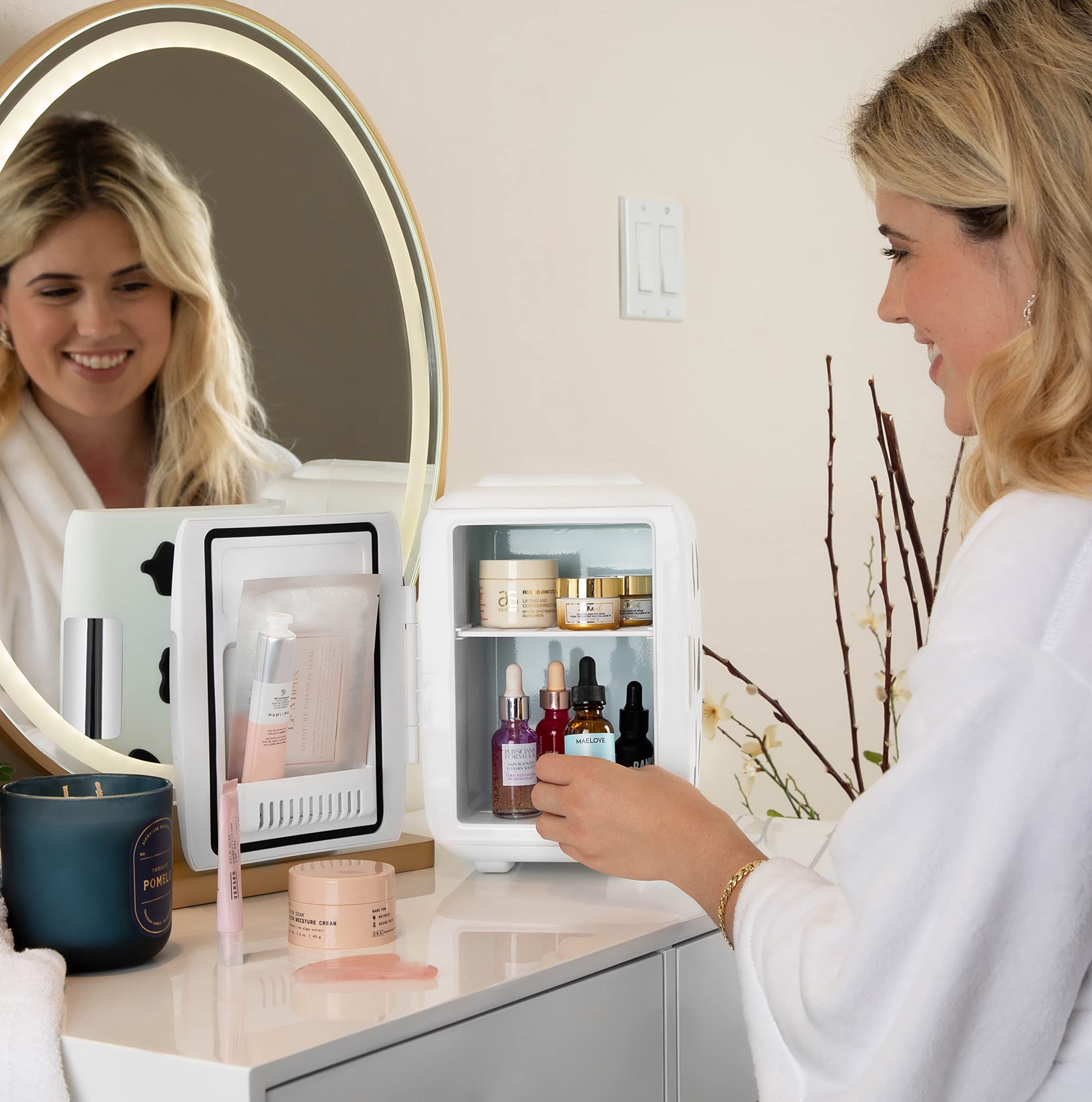 Cooluli skincare storage in a cow-print fridge keeps items organized.