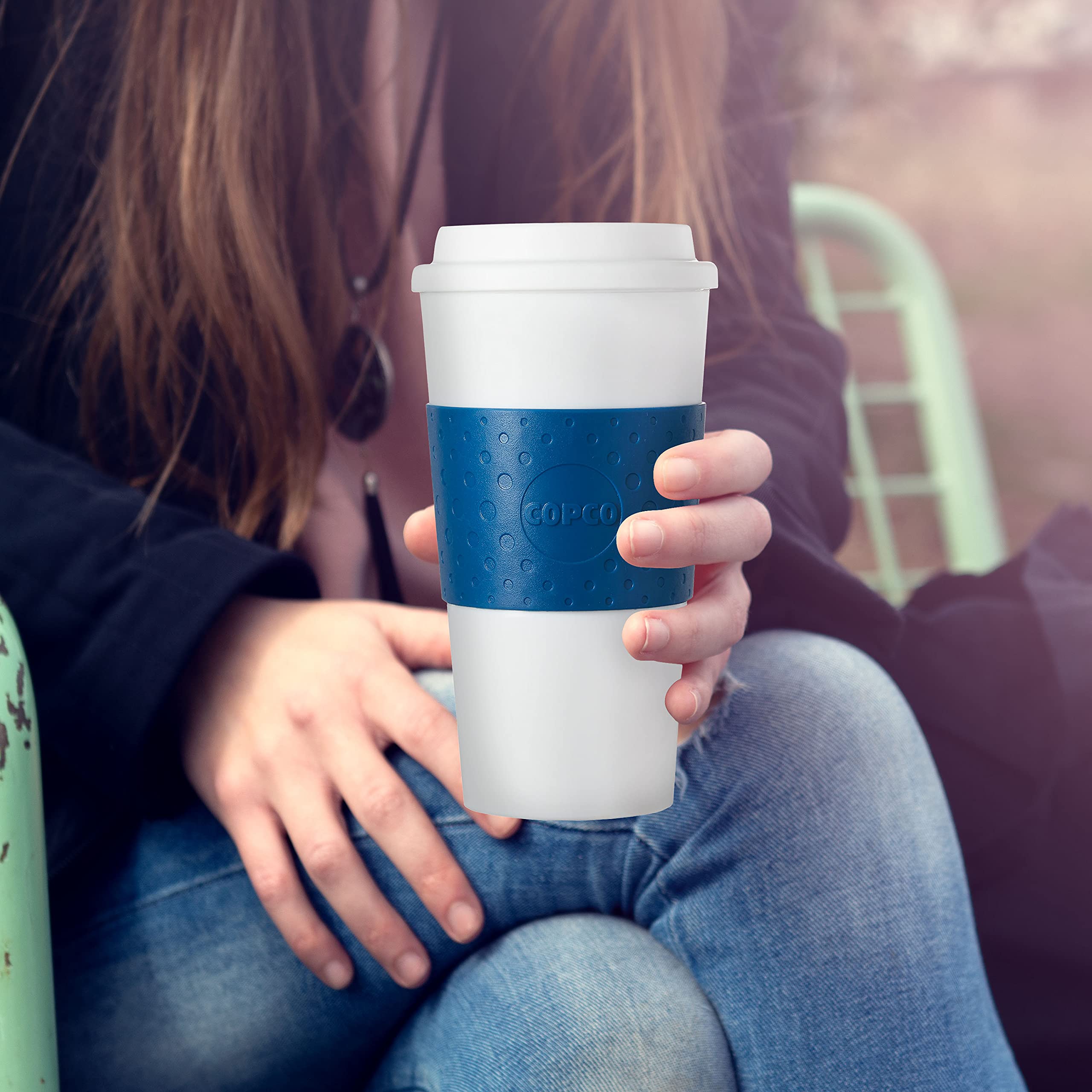 Copco Acadia travel mug, leak-proof lid in action preventing spills.