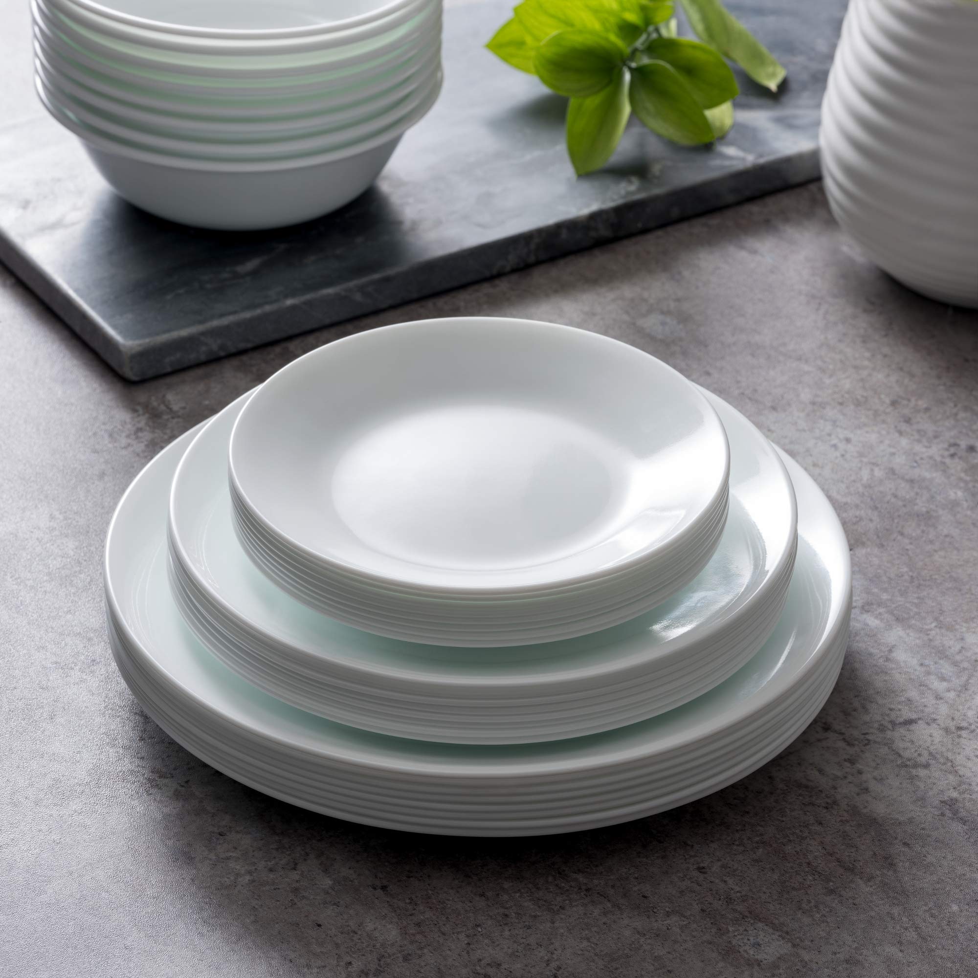 Corelle Vitrelle Winter Frost White plates arranged on table; minimalist, classic look for any table setting.
