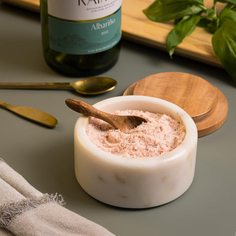 Spoon included for precise pinch seasoning at the table.
