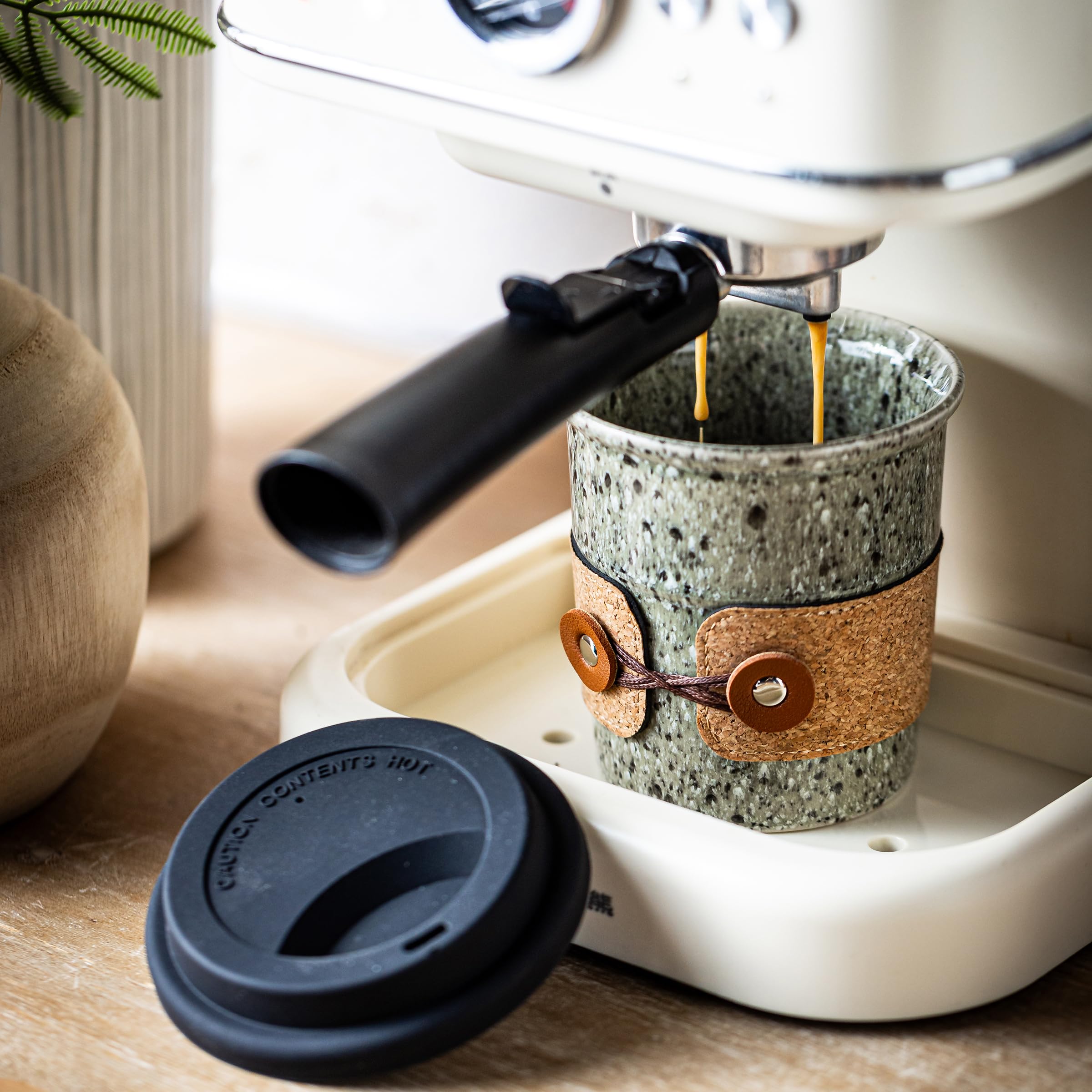Cormomu Coffee Travel Mug leather band provides a non-slip grip