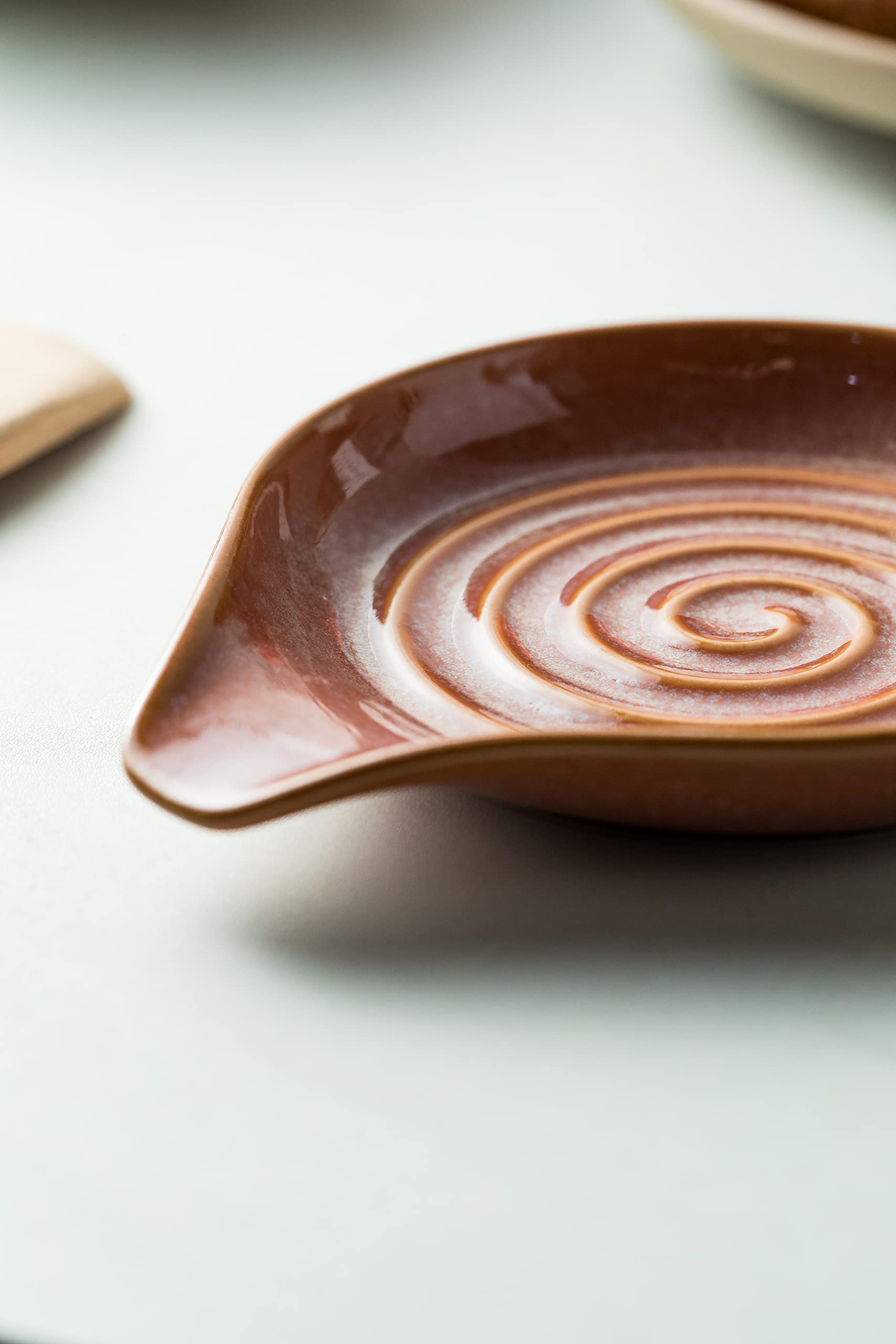 Cormomu spoon rest measures about 6x5 inches for common utensils.