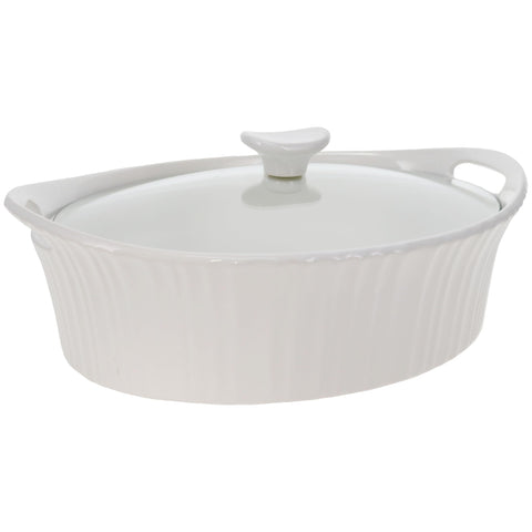 CorningWare French White oval casserole on table ready for serving.