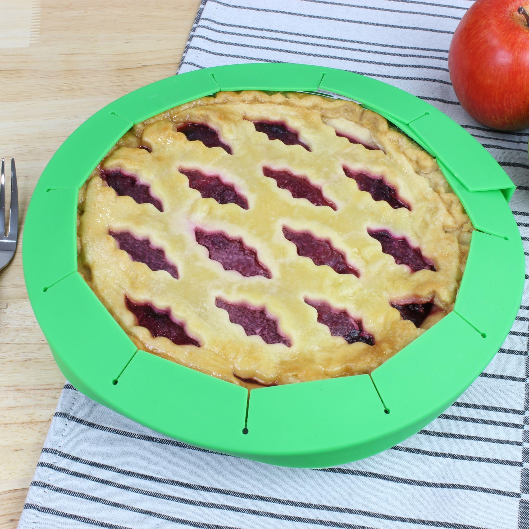 Adjustable shield fits pies from 8.5 to 11 inches for even browning