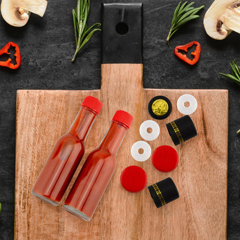 Black shrink bands finish the Cornucopia Brands mini bottle setup.