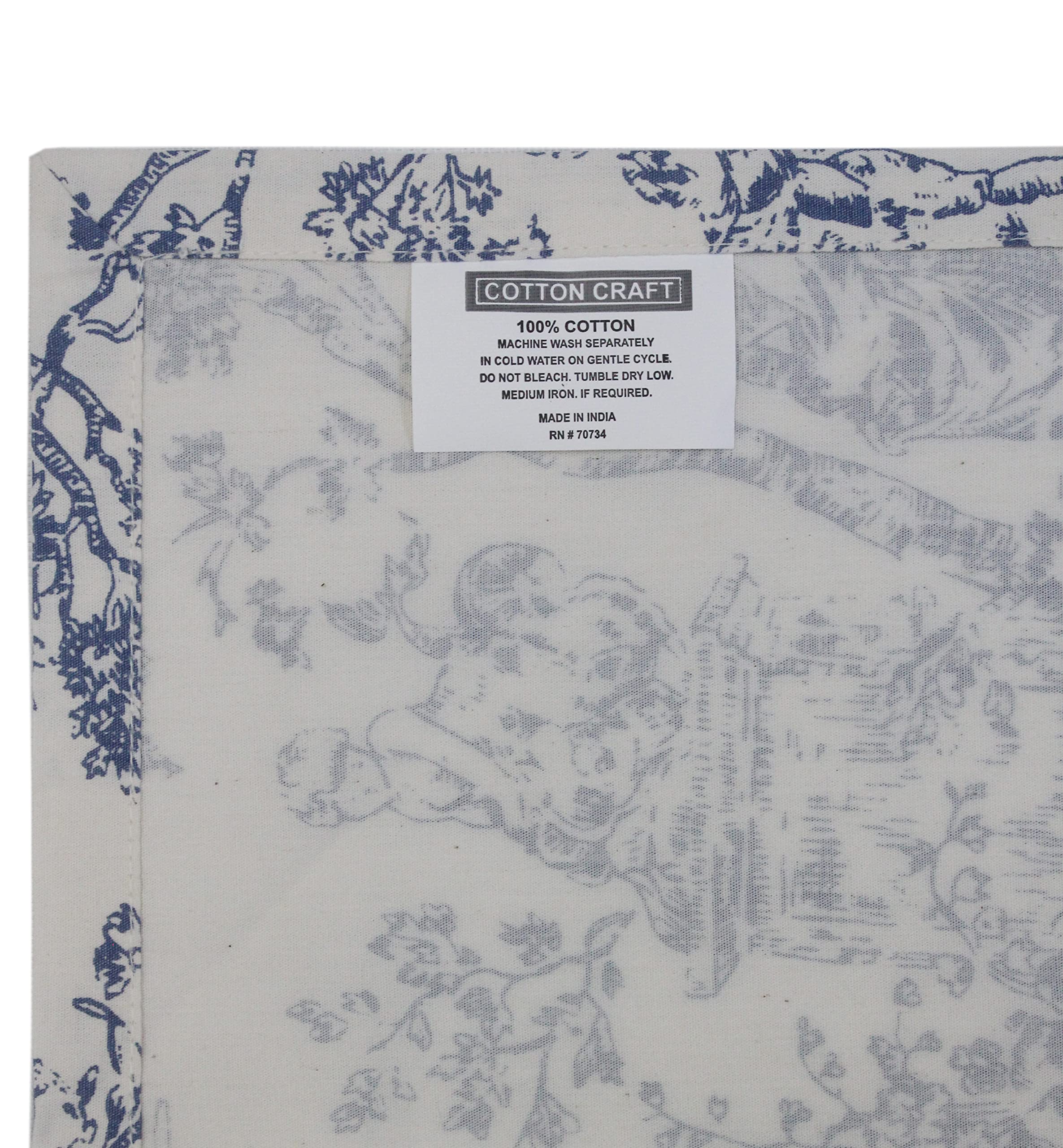 COTTON CRAFT table setting showcases navy toile napkins for holidays.