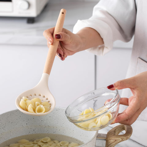 Country Kitchen utensil holder helps keep counters organized.