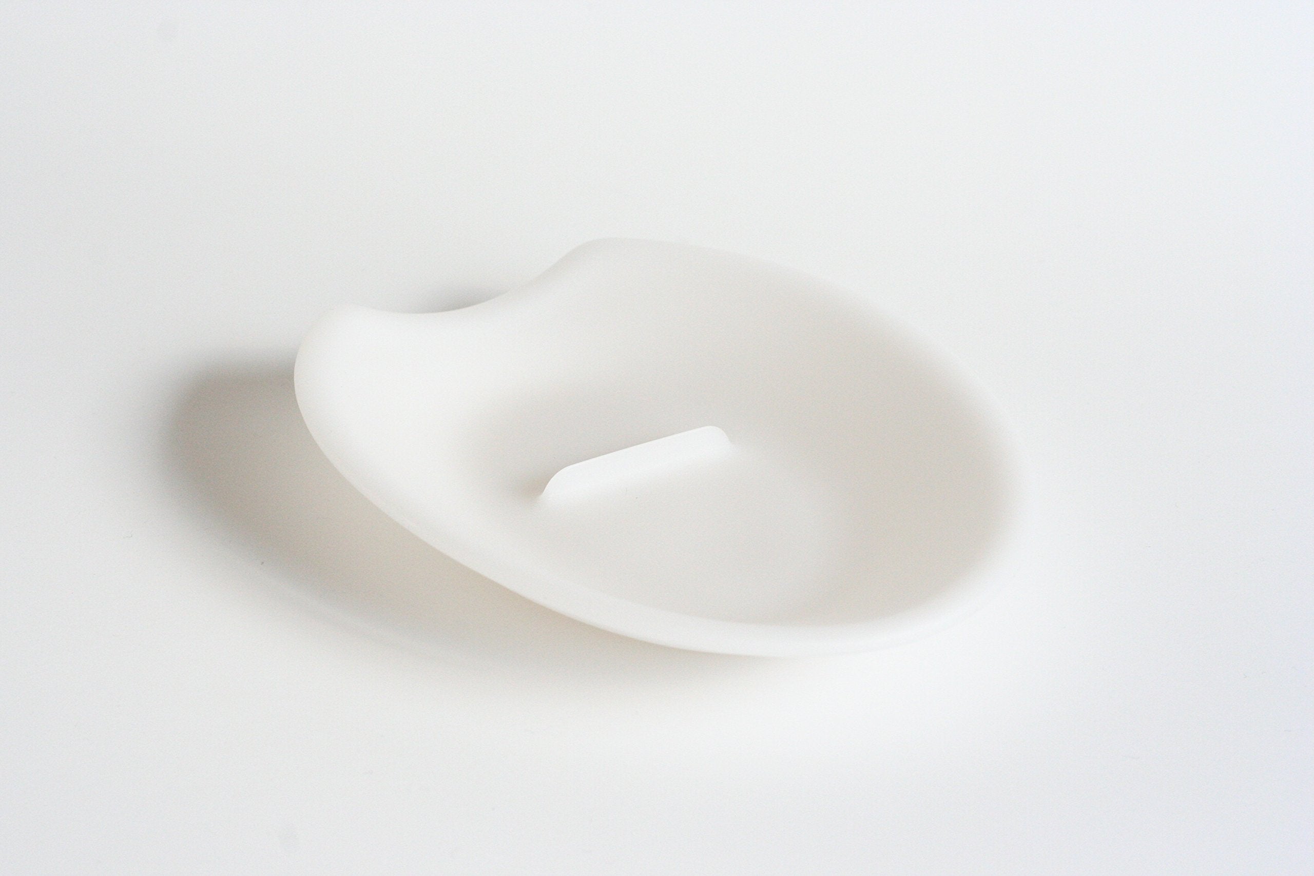 Crack'em egg cracker edge closeup showing clean cracking line for yolk-friendly separation