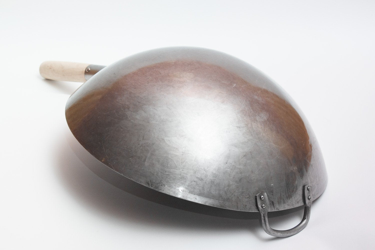 Close-up of the hammered texture showing strength and durability for professional-style wok cooking.