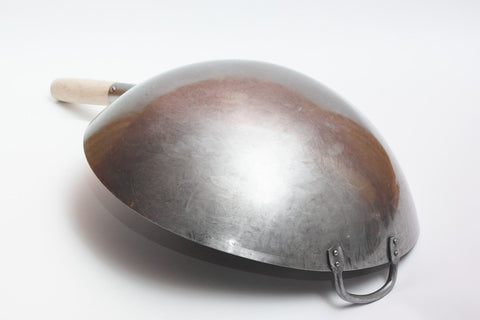 Close-up of the hammered texture showing strength and durability for professional-style wok cooking.