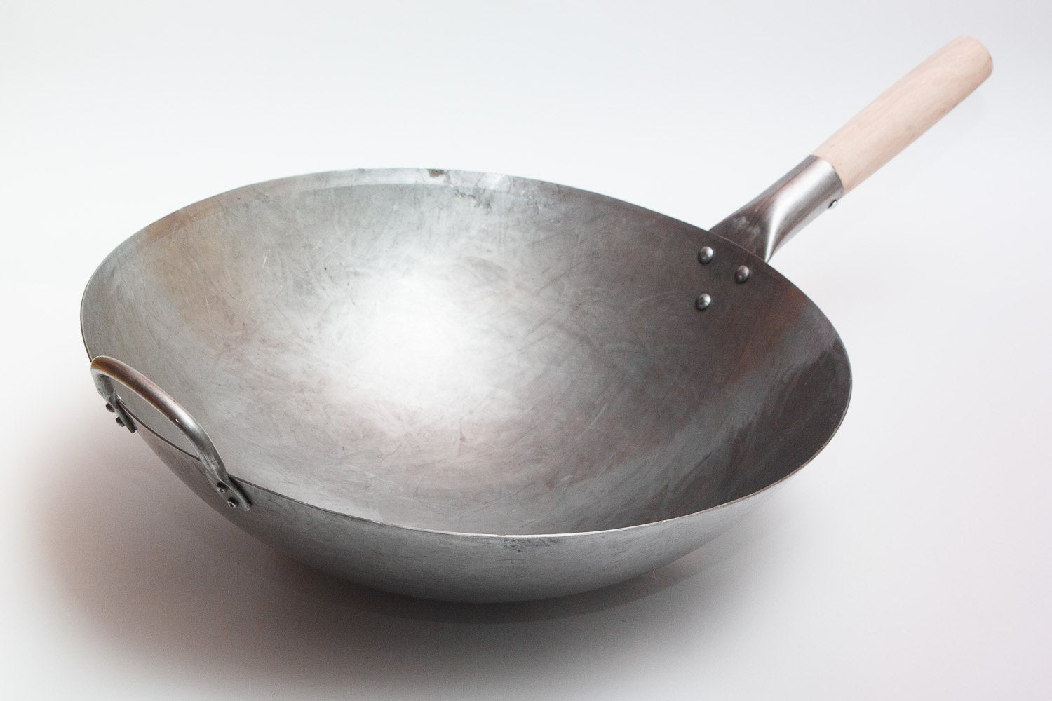 Hand hammering by Guangzhou artisans adds authentic texture and culinary heritage.