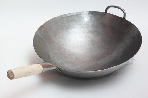 Round-bottom wok design promotes fast heat distribution for quick, even stir-fries.
