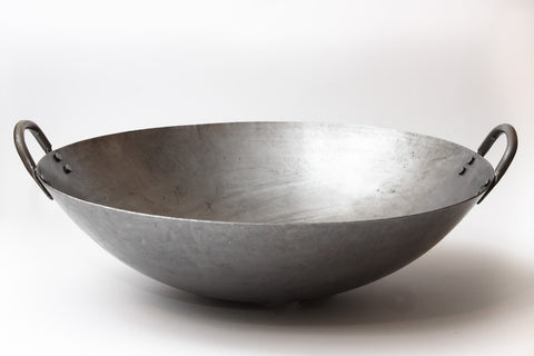Craft Wok carbon-steel 15-gauge 16-inch pan for fast searing.