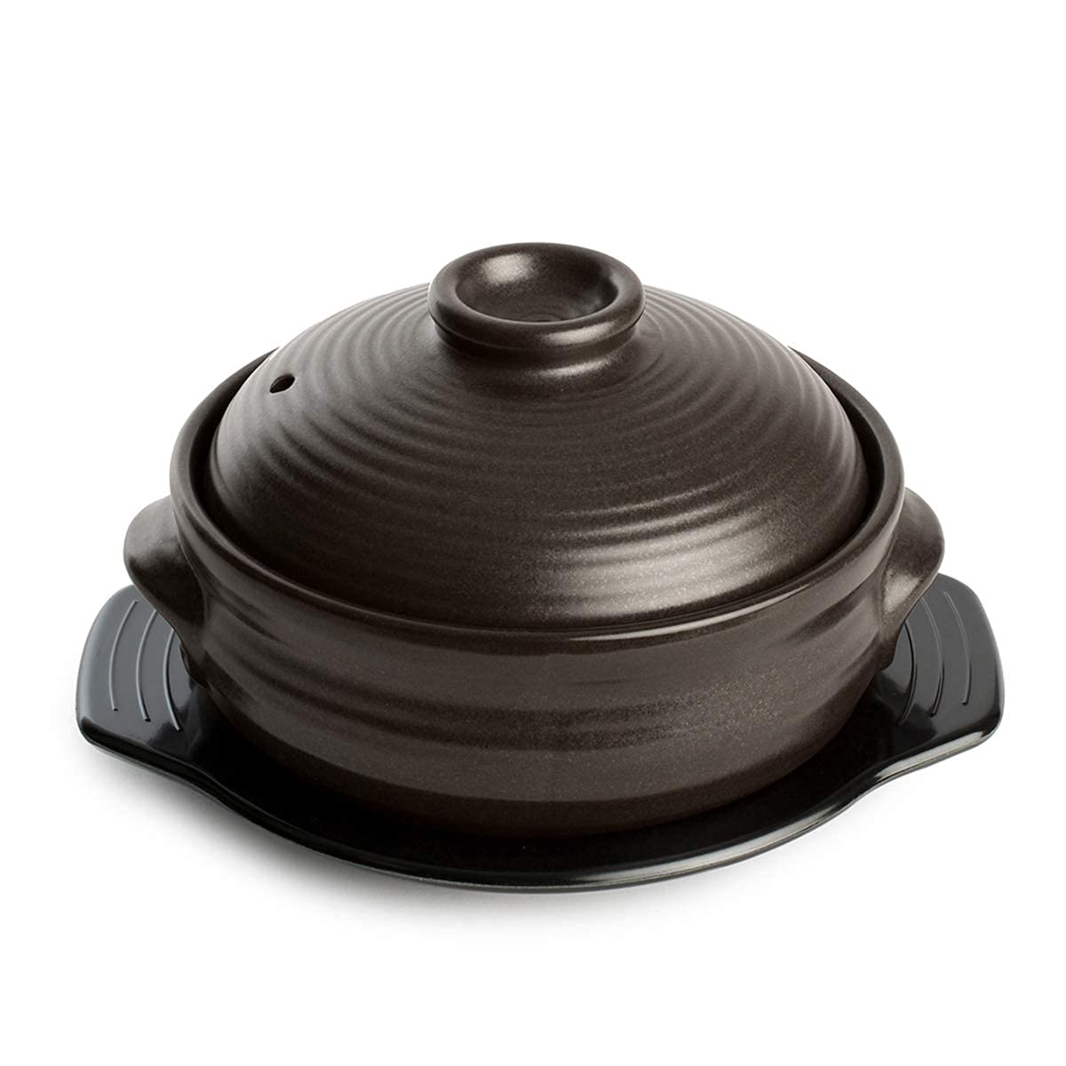 Crazy Korean Cooking dolsot stone bowl with lid on stovetop for sizzling bibimbap