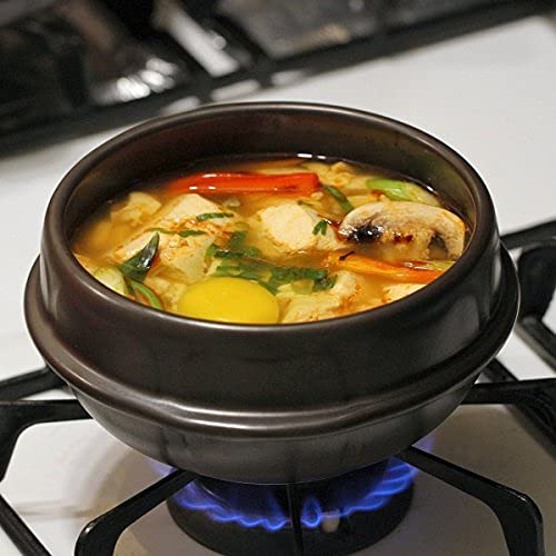 Crazy Korean Cooking black plastic trivet included for heat protection.