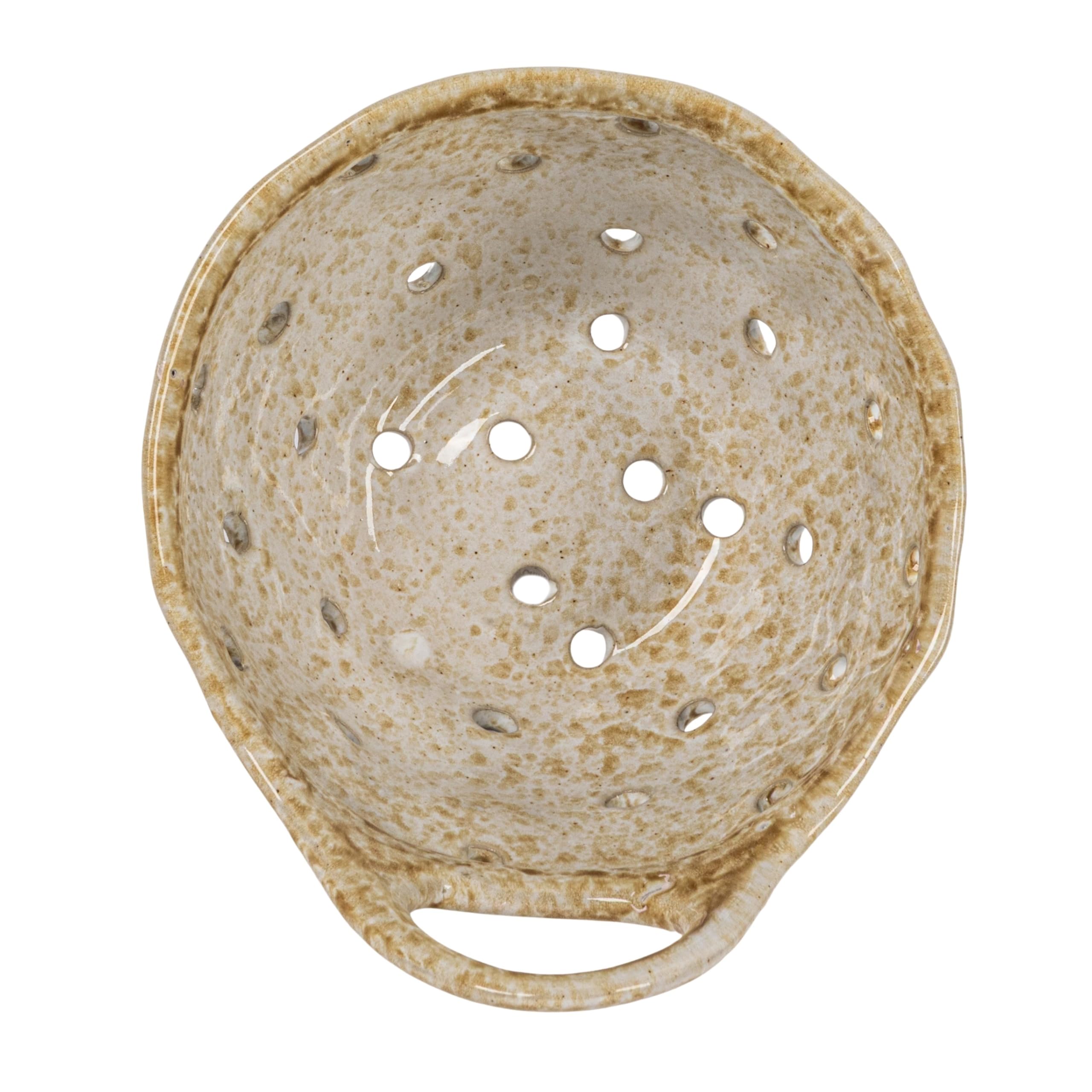 Creative Co-Op close-up of beige stoneware colander texture
