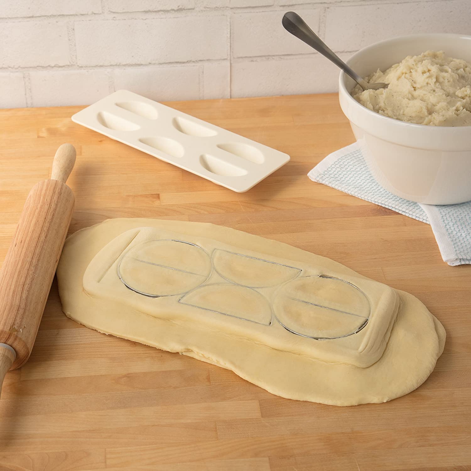 CucinaPro holiday kitchen pierogi assembly invites family for festive cooking