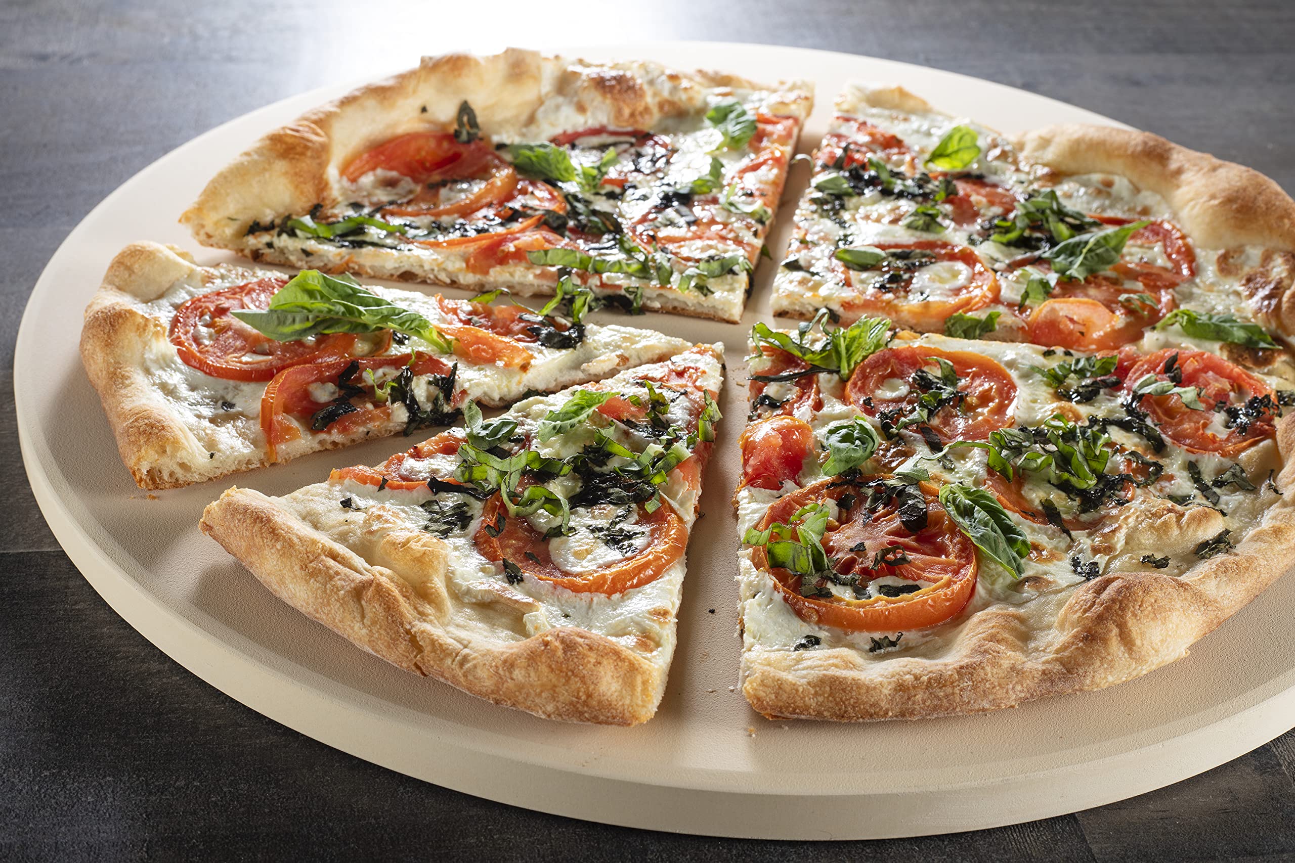 CucinaPro stone distributes heat across dough for uniform crust.