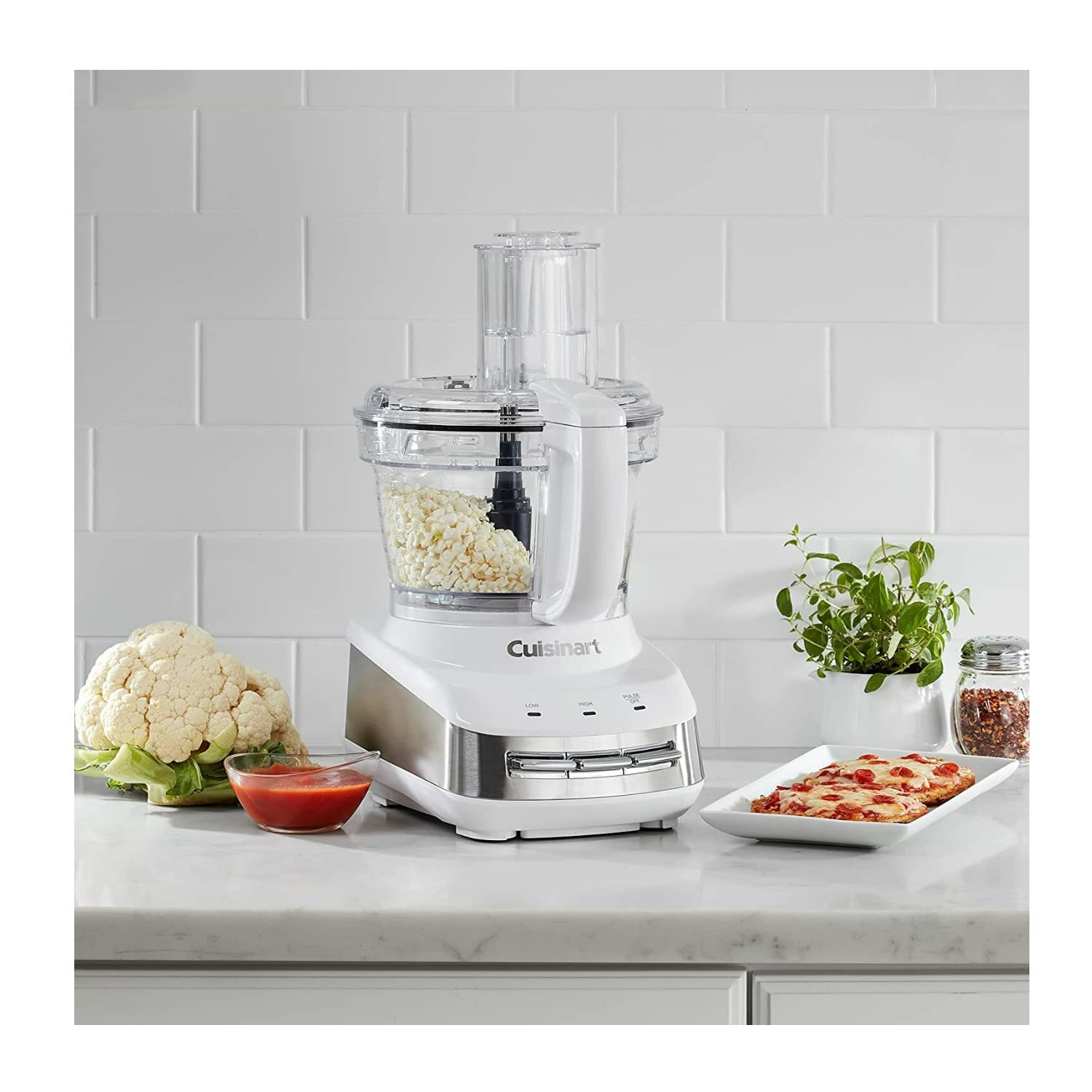 Cuisinart FP-110 accessory hub stores optional attachments neatly.
