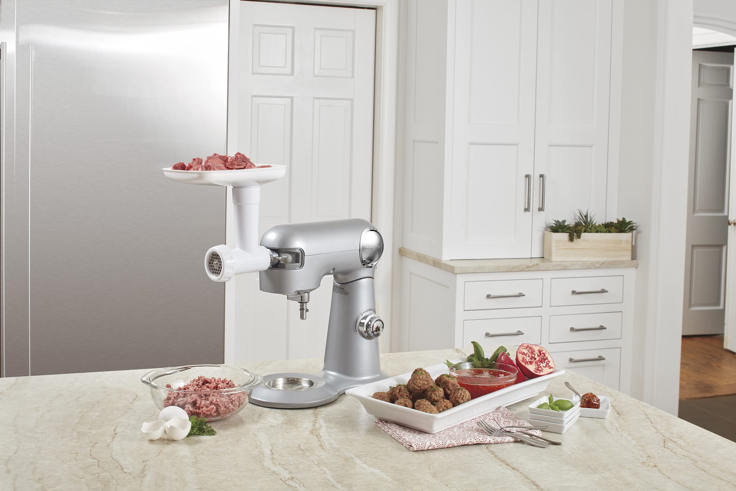 Cuisinart MG-50 attached for sausage making with spacer plates and nozzles