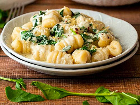 Cuisinox beachwood board, 8x5, supports consistent gnocchi sizing.