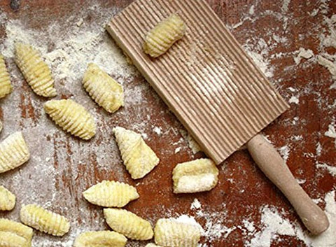 Cuisinox grooved board creates grooved butter balls for serving.