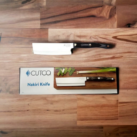 Cutco Nakiri knife with straight blade enables precise vegetable slicing.