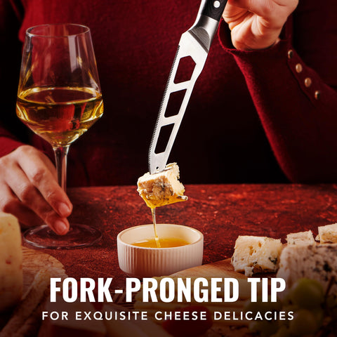 Cutluxe cheese knife with pronged tip lifts slices effortlessly