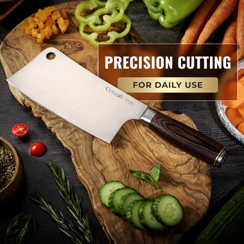 Cutluxe cleaver slicing through meat and vegetables, showcasing versatility in the Shinobi Series.