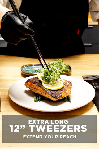 Close-up of Dalstrong black titanium coated tongs showing durability.