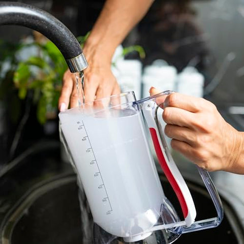 Dalup batter dispenser close-up on handle highlights easy-squeeze operation for kids.