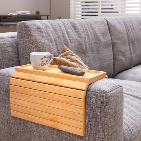 Danfoxer arm tray shows anti-slip rim securing drinks on a sofa