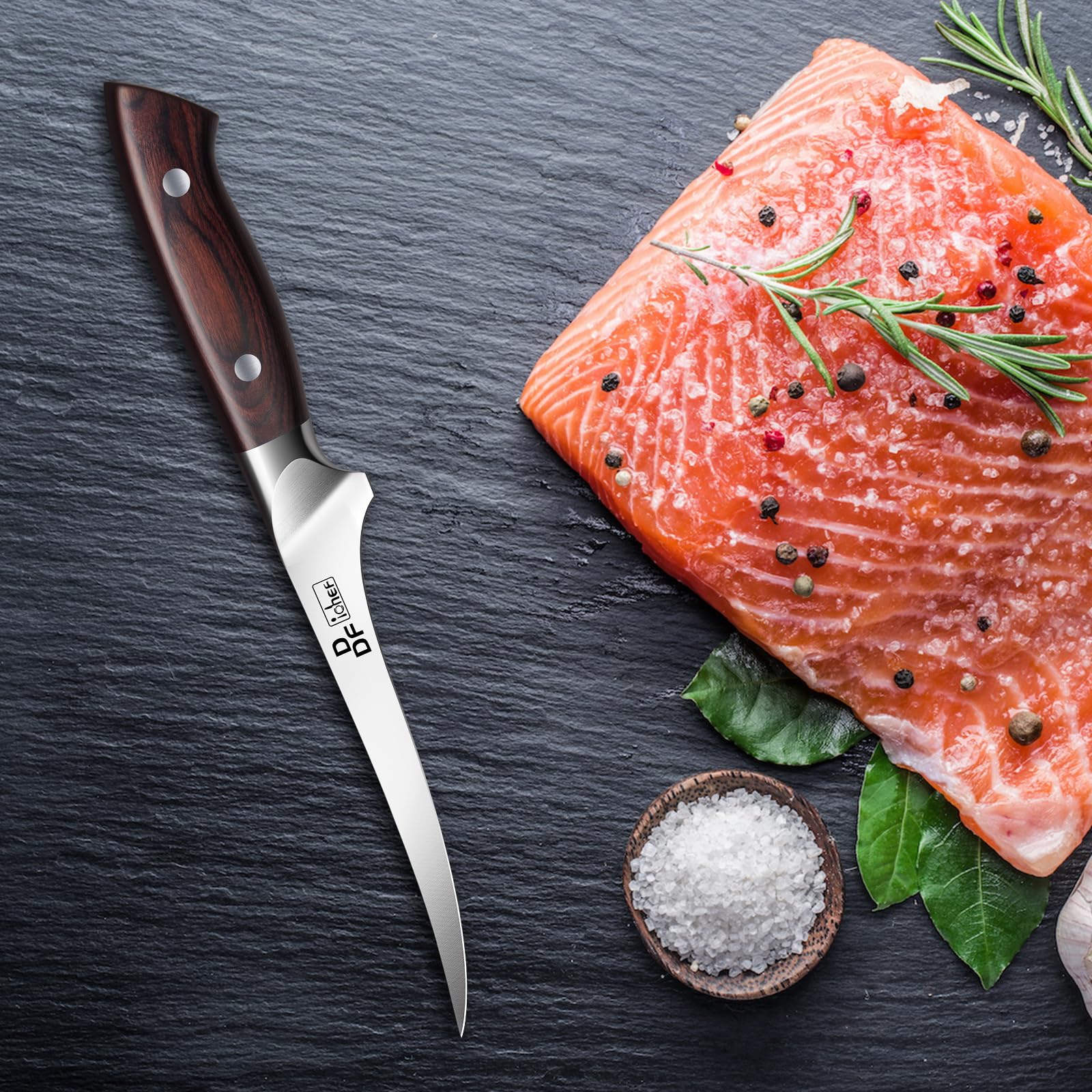 DDF iohEF fillet knife used to fillet fish on a cutting board.