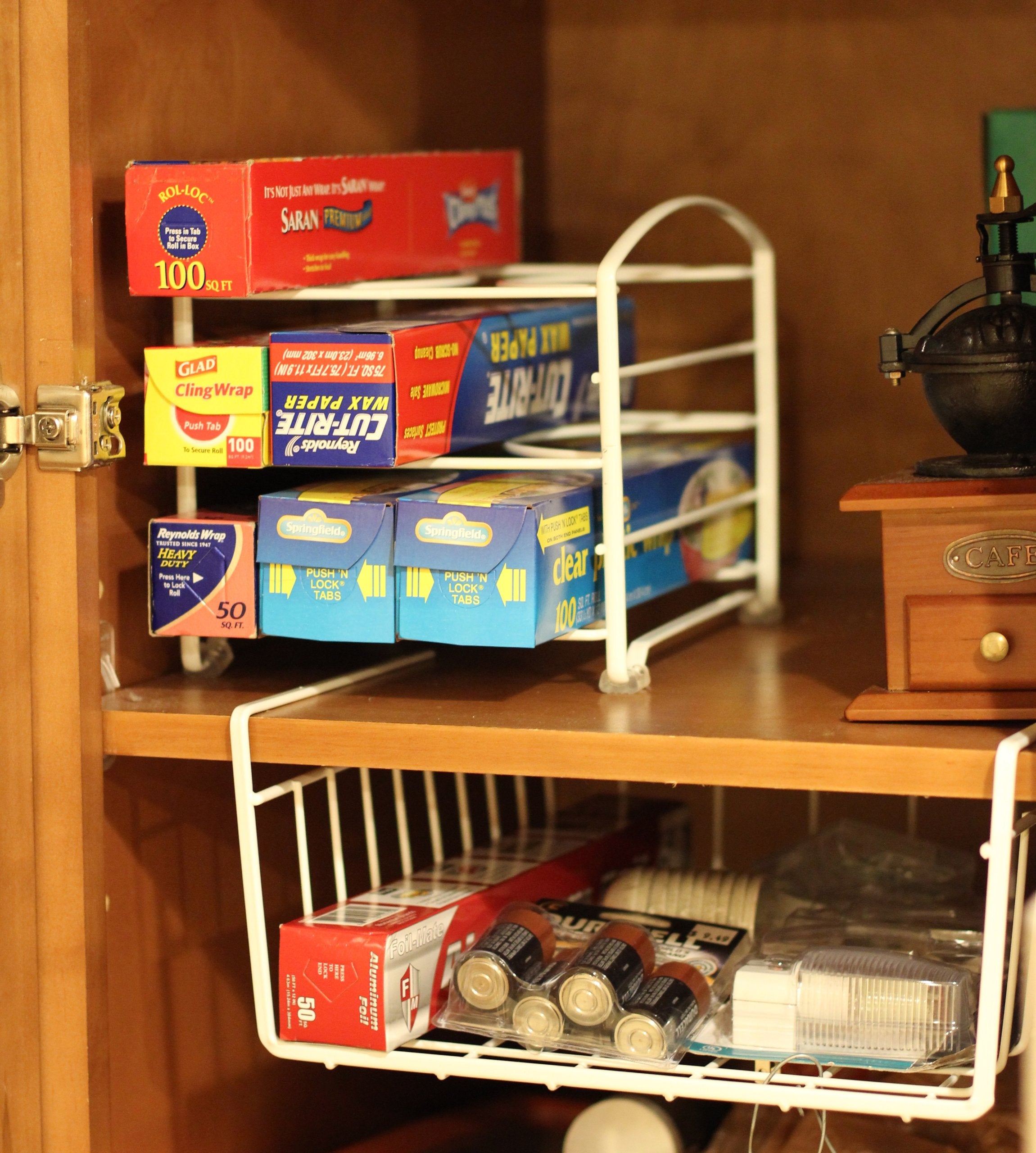 Wrap organizer dimensions 9.5 inches deep by 7.5 inches wide for kitchen cabinet use.